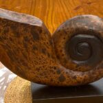 Decorative hand carved wooden shell on stand